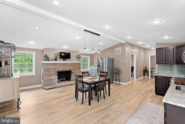 83 Ridge Crest Dr, Harpers Ferry, WV 25425 - dining room with baseboards, light wood-style flooring, a stone fireplace, and recessed lighting
