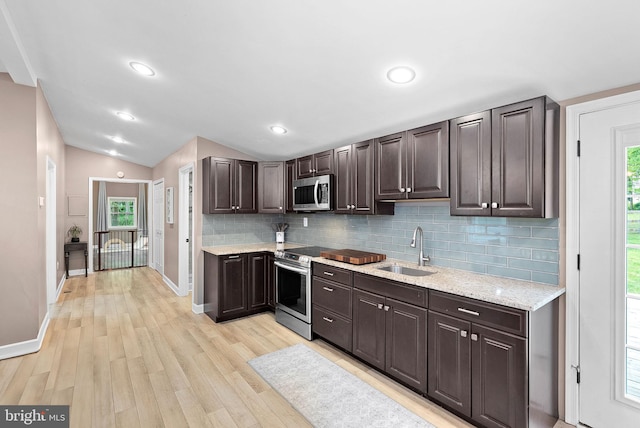 83 Ridge Crest Dr, Harpers Ferry, WV 25425 - kitchen featuring a sink, appliances with stainless steel finishes, backsplash, baseboards, and dark brown cabinetry