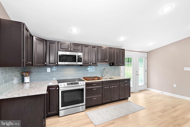83 Ridge Crest Dr, Harpers Ferry, WV 25425 - kitchen featuring appliances with stainless steel finishes, a sink, backsplash, light wood-style flooring, and recessed lighting