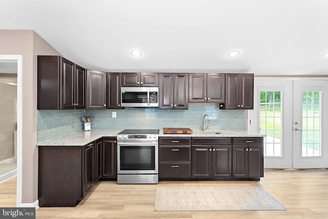 83 Ridge Crest Dr, Harpers Ferry, WV 25425 - kitchen featuring appliances with stainless steel finishes, light wood-style floors, a sink, dark brown cabinets, and recessed lighting