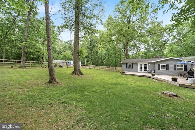 83 Ridge Crest Dr, Harpers Ferry, WV 25425 - view of yard featuring a wooden deck, french doors, and view of wooded area