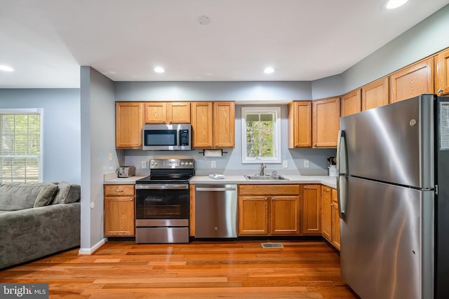 392 Passage Ln, Mc Gaheysville, VA 22840 - kitchen with appliances with stainless steel finishes, a sink, light countertops, light wood-style flooring, and recessed lighting