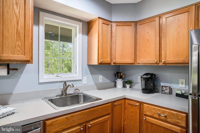 392 Passage Ln, Mc Gaheysville, VA 22840 - kitchen featuring a sink, light countertops, freestanding refrigerator, and brown cabinets