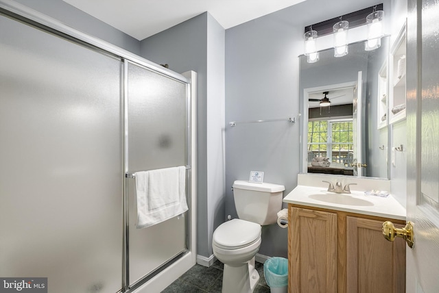 392 Passage Ln, Mc Gaheysville, VA 22840 - bathroom with a ceiling fan, a shower stall, vanity, and toilet