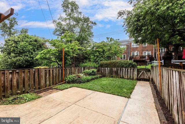 view of patio with a gate