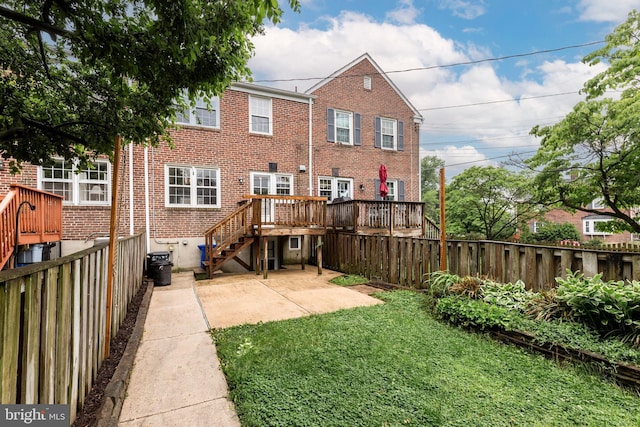 rear view of property with brick siding, a deck, a patio, and stairs