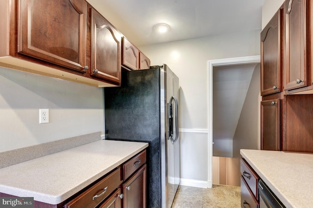kitchen featuring stainless steel fridge with ice dispenser and light countertops