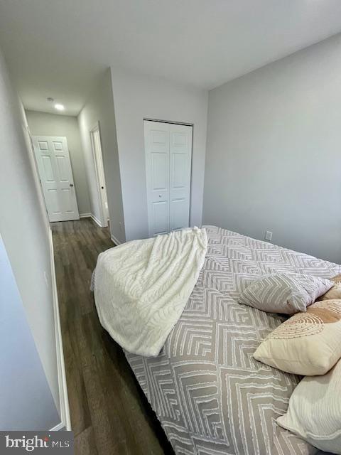 263 S Hilton St, Baltimore, MD 21229 - bedroom featuring wood finished floors and a closet
