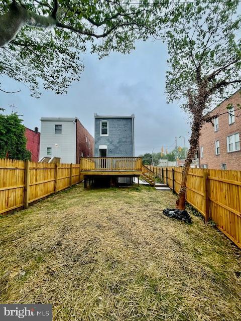 263 S Hilton St, Baltimore, MD 21229 - fenced backyard featuring a wooden deck