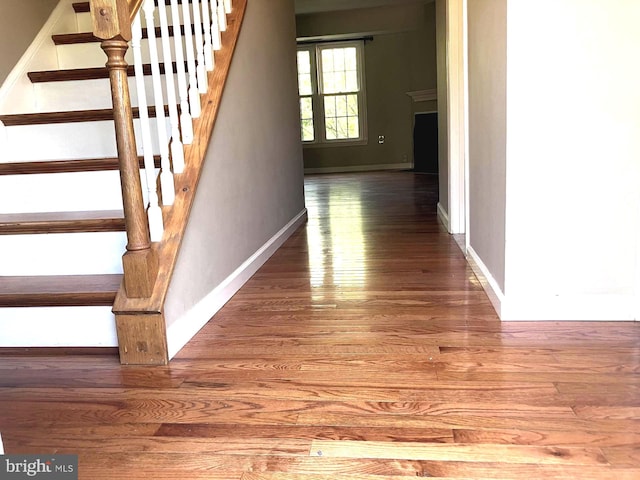 9118 Bobwhite Cir, Gaithersburg, MD 20879 - stairs with hardwood / wood-style floors and baseboards