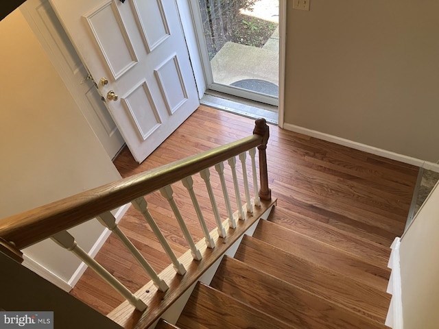 9118 Bobwhite Cir, Gaithersburg, MD 20879 - stairway with hardwood / wood-style floors and baseboards