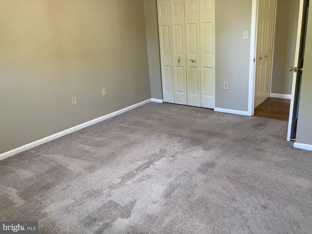 9118 Bobwhite Cir, Gaithersburg, MD 20879 - unfurnished bedroom with carpet flooring, a closet, and baseboards