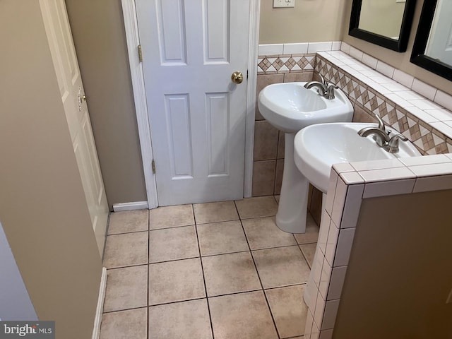 9118 Bobwhite Cir, Gaithersburg, MD 20879 - bathroom with tile patterned floors and a sink