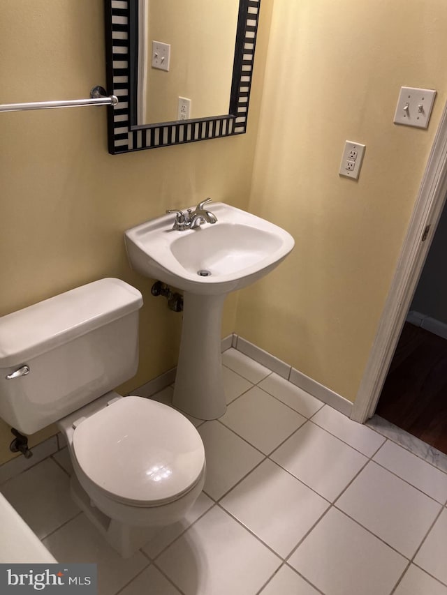 9118 Bobwhite Cir, Gaithersburg, MD 20879 - half bathroom with toilet, tile patterned floors, and baseboards