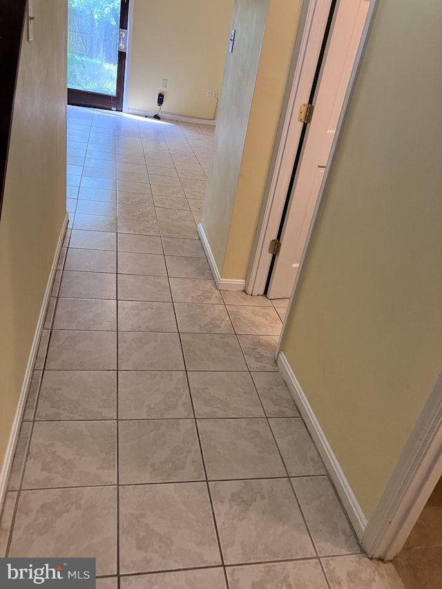 9118 Bobwhite Cir, Gaithersburg, MD 20879 - corridor featuring light tile patterned floors and baseboards