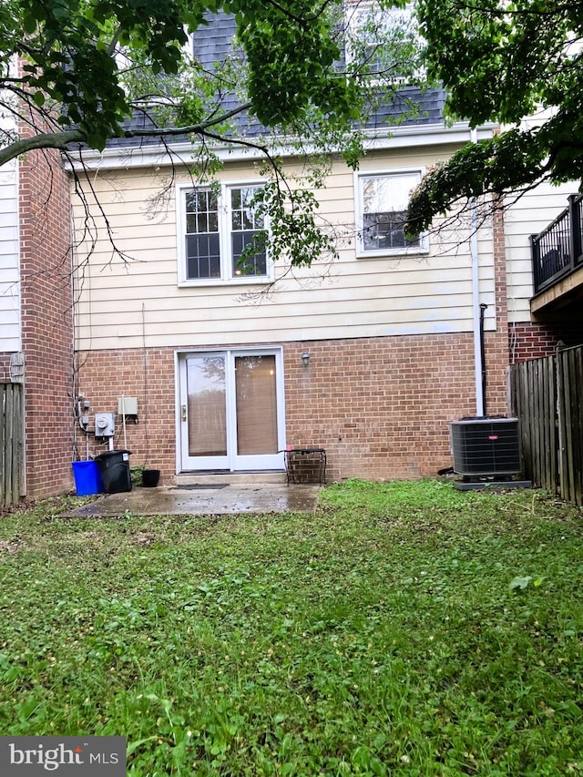 9118 Bobwhite Cir, Gaithersburg, MD 20879 - rear view of house featuring central air condition unit and brick siding