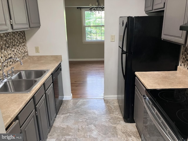 9118 Bobwhite Cir, Gaithersburg, MD 20879 - kitchen featuring gray cabinets, a sink, and baseboards