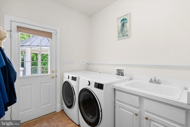 301 Reserve Gate Ter, Silver Spring, MD 20905 - laundry room featuring washer and dryer, cabinet space, and light tile patterned flooring
