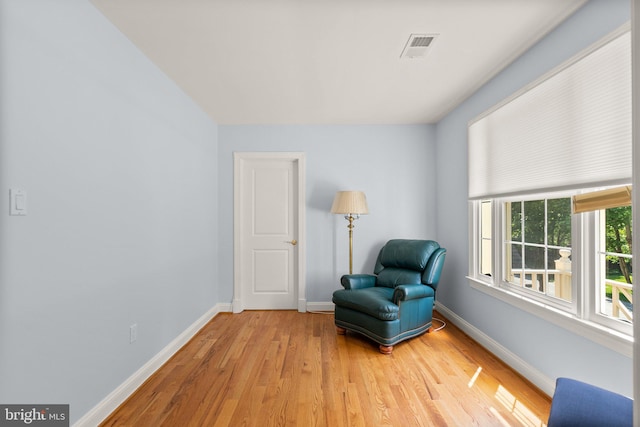 301 Reserve Gate Ter, Silver Spring, MD 20905 - sitting room with baseboards and light wood finished floors
