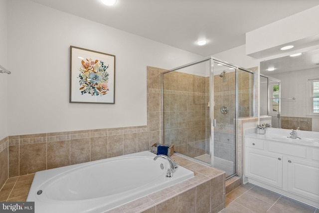 301 Reserve Gate Ter, Silver Spring, MD 20905 - full bath featuring a bath, vanity, a shower stall, and tile patterned floors