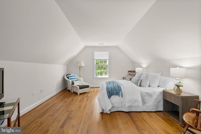 301 Reserve Gate Ter, Silver Spring, MD 20905 - bedroom featuring wood finished floors, lofted ceiling, and baseboards