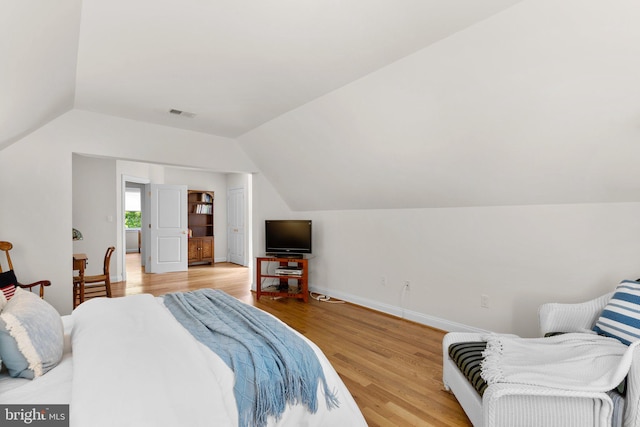 301 Reserve Gate Ter, Silver Spring, MD 20905 - bedroom featuring vaulted ceiling, light wood-style flooring, and baseboards