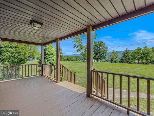 3906 Highland Ridge Rd, Berkeley Springs, WV 25411 - deck with a lawn and view of scattered trees