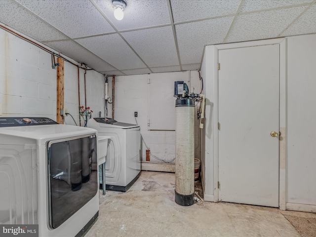 3906 Highland Ridge Rd, Berkeley Springs, WV 25411 - laundry area featuring washing machine and dryer and concrete block wall