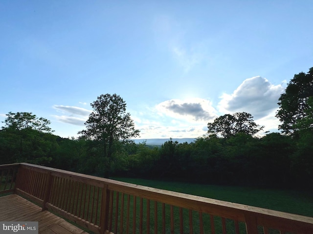 3906 Highland Ridge Rd, Berkeley Springs, WV 25411 - wooden deck featuring a yard and a view of trees