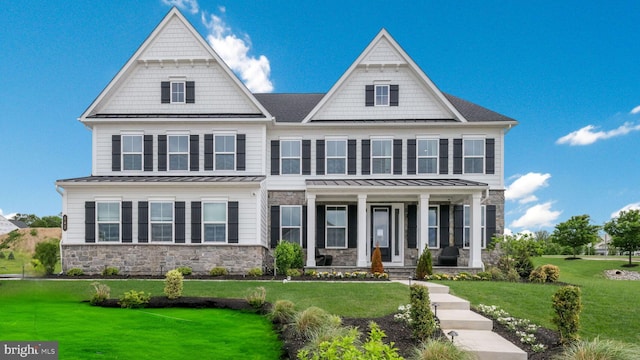 143 Adrienne Ct, West Chester, PA 19380 - view of front of home featuring covered porch, stone siding, a standing seam roof, and a front lawn
