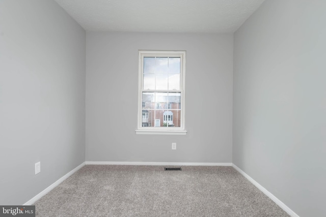 17 Powhurst Ct, Nottingham, MD 21236 - unfurnished room featuring carpet floors, baseboards, and a textured ceiling