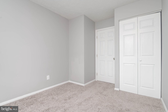 17 Powhurst Ct, Nottingham, MD 21236 - unfurnished bedroom with carpet, baseboards, a textured ceiling, and a closet