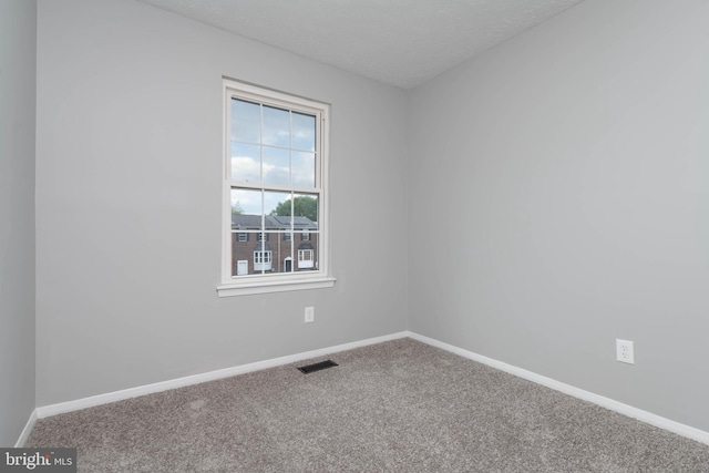 17 Powhurst Ct, Nottingham, MD 21236 - empty room with carpet floors, baseboards, and a textured ceiling