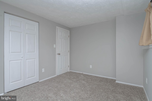 17 Powhurst Ct, Nottingham, MD 21236 - unfurnished bedroom featuring carpet flooring, a textured ceiling, a closet, and baseboards