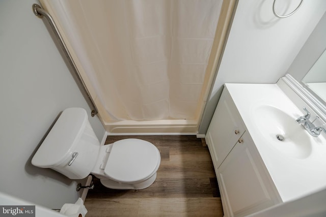 17 Powhurst Ct, Nottingham, MD 21236 - full bath with wood finished floors, a stall shower, vanity, and toilet