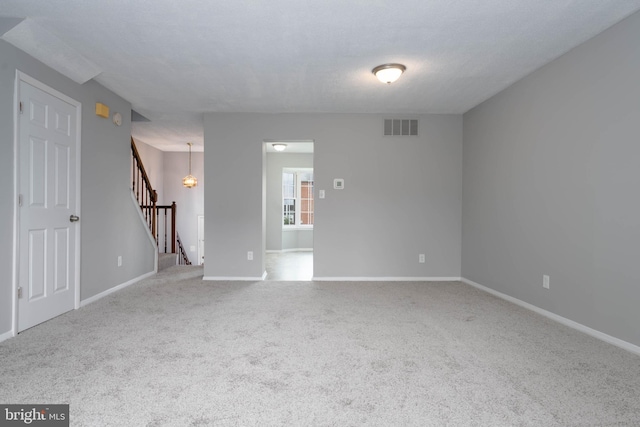 17 Powhurst Ct, Nottingham, MD 21236 - empty room featuring carpet floors, baseboards, and stairway