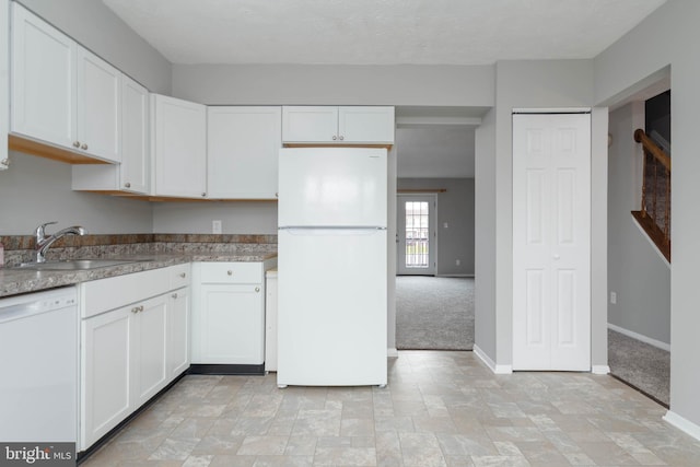 17 Powhurst Ct, Nottingham, MD 21236 - kitchen with white appliances, baseboards, a sink, and white cabinetry