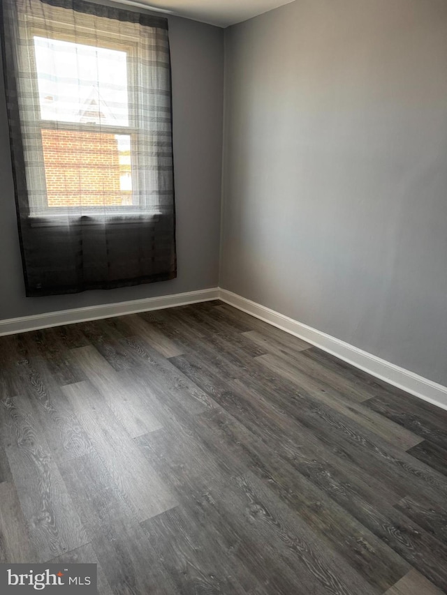 4602 Ashville St, Philadelphia, PA 19136 - unfurnished room featuring dark wood-style flooring and baseboards