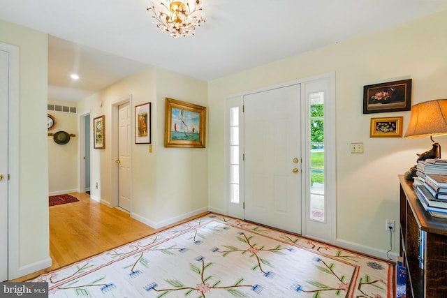 300 Hickory Ln, Chestertown, MD 21620 - entrance foyer with a chandelier and light wood finished floors