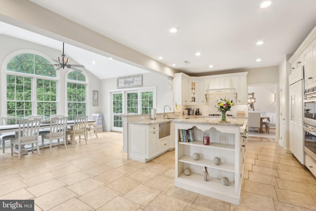 13 Lenape Ct, Mount Laurel, NJ 08054 - kitchen with open shelves, premium range hood, a peninsula, backsplash, and a sink