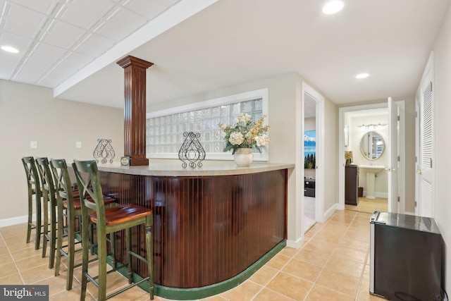 13 Lenape Ct, Mount Laurel, NJ 08054 - indoor dry bar featuring baseboards, light tile patterned floors, recessed lighting, and decorative columns