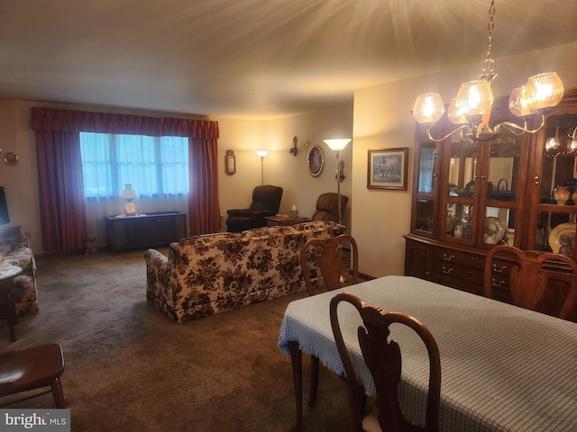 carpeted bedroom featuring a chandelier
