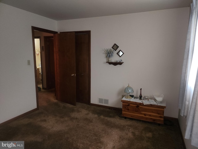 carpeted bedroom featuring a closet
