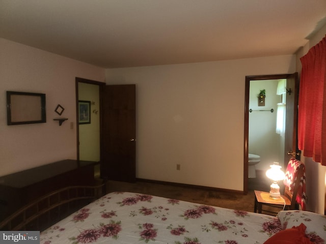 bedroom featuring carpet floors and baseboards