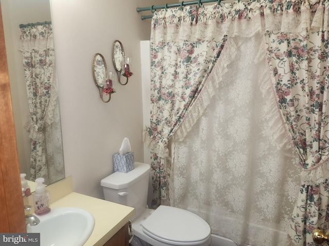 full bathroom with toilet, vanity, and shower / bath combo with shower curtain