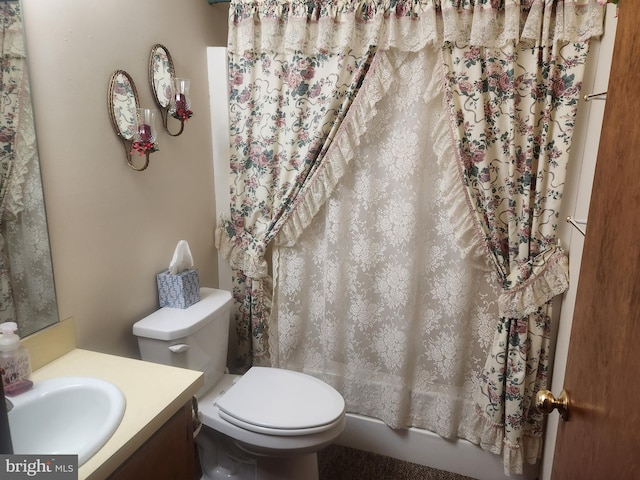 full bathroom with toilet, vanity, and shower / tub combo with curtain