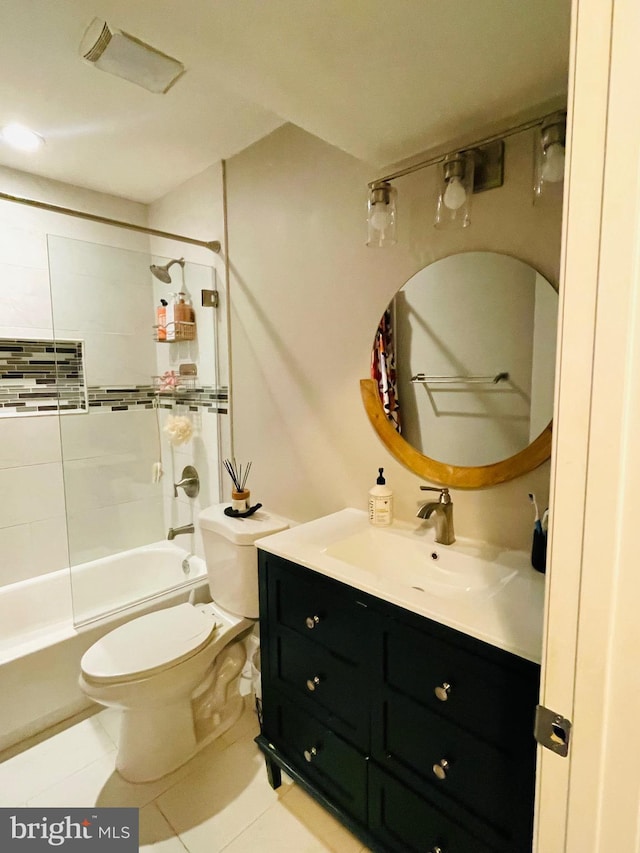 bathroom with toilet, tile patterned floors, vanity, and shower / tub combination