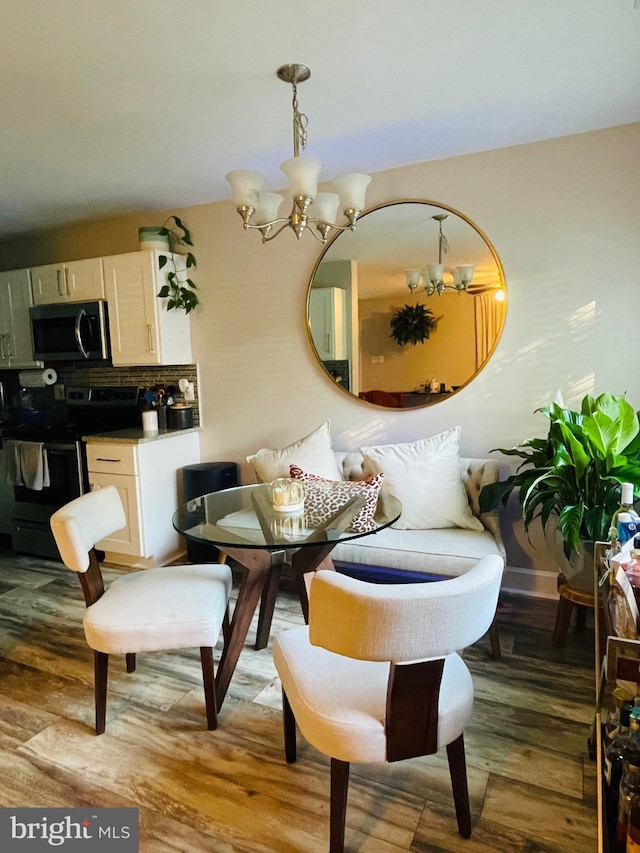 dining room with a chandelier and light wood-style floors