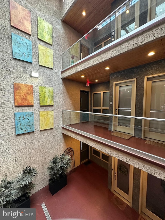 common area featuring a high ceiling and recessed lighting