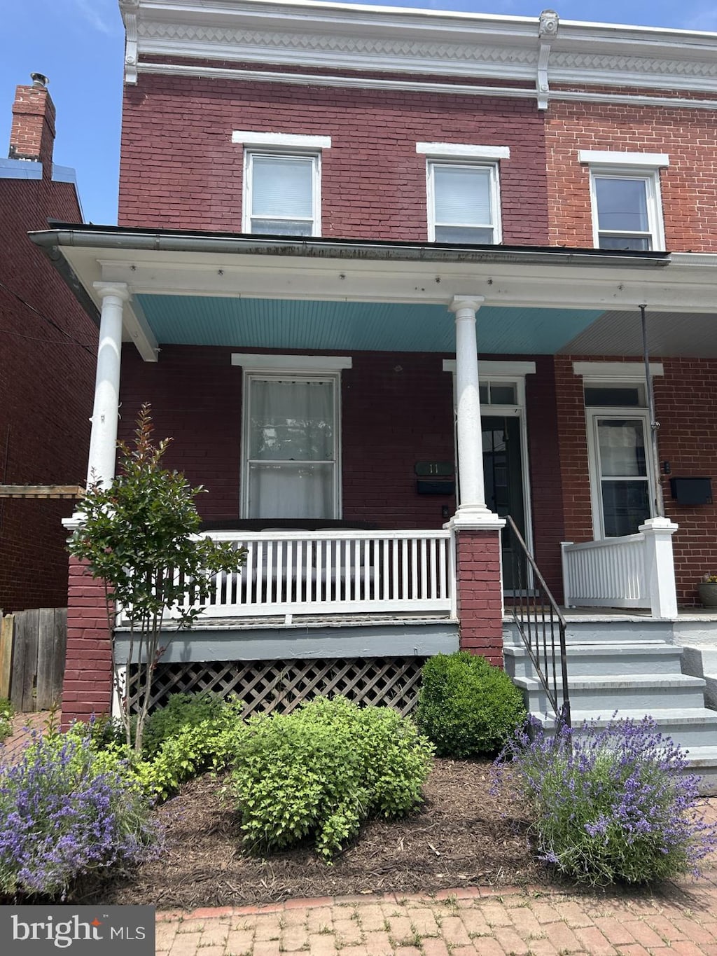 11 S Jefferson St, Frederick, MD 21701 - view of front of house featuring a porch and brick siding
